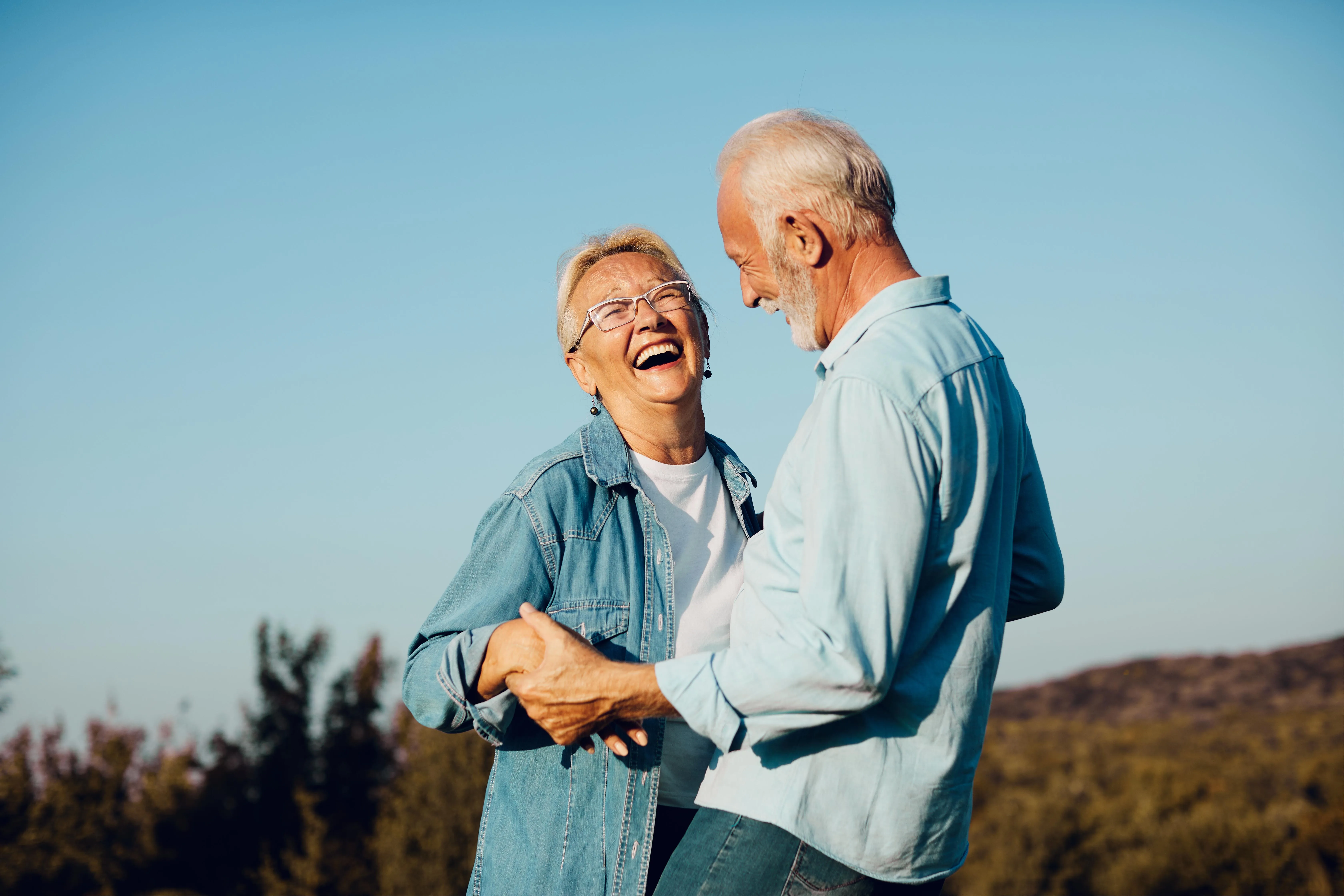 woman man outdoor senior couple happy lifestyle retirement toget Happy active senior couple outdoors